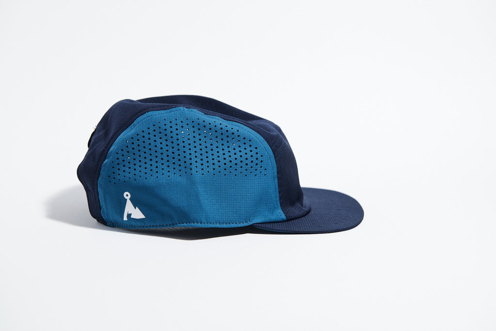 GORRA DE CARRERAS CON PLUMA VÅGA - NARANJA NEÓN / CIRUELA