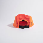 GORRA DE CARRERAS CON PLUMA VÅGA - NARANJA NEÓN / CIRUELA