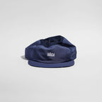 GORRA DE CARRERAS CON PLUMA VÅGA - NARANJA NEÓN / CIRUELA