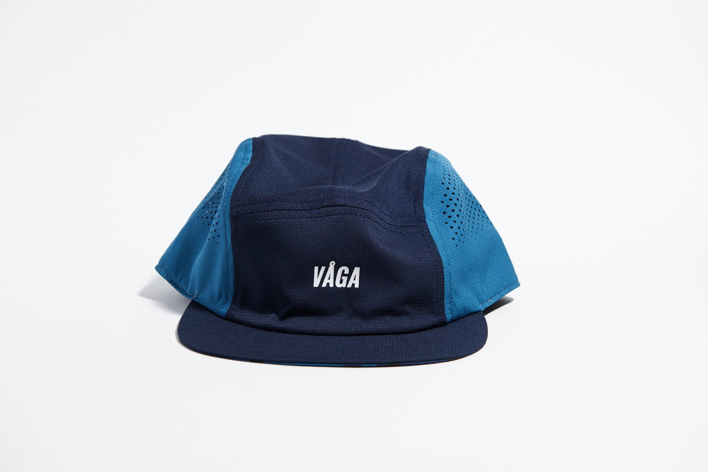 GORRA DE CARRERAS CON PLUMA VÅGA - NARANJA NEÓN / CIRUELA
