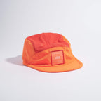 GORRA DE CARRERAS CON PLUMA VÅGA - NARANJA NEÓN / CIRUELA