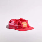 GORRA DE CARRERAS CON PLUMA VÅGA - NARANJA NEÓN / CIRUELA