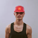 GORRA DE CARRERAS CON PLUMA VÅGA - NARANJA NEÓN / CIRUELA