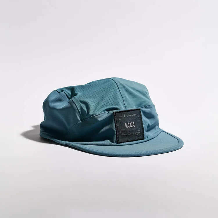 GORRA DE CARRERAS CON PLUMA VÅGA - NARANJA NEÓN / CIRUELA