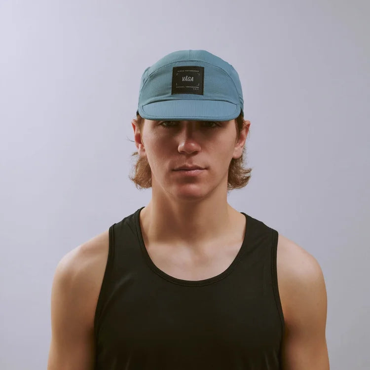 GORRA DE CARRERAS CON PLUMA VÅGA - NARANJA NEÓN / CIRUELA